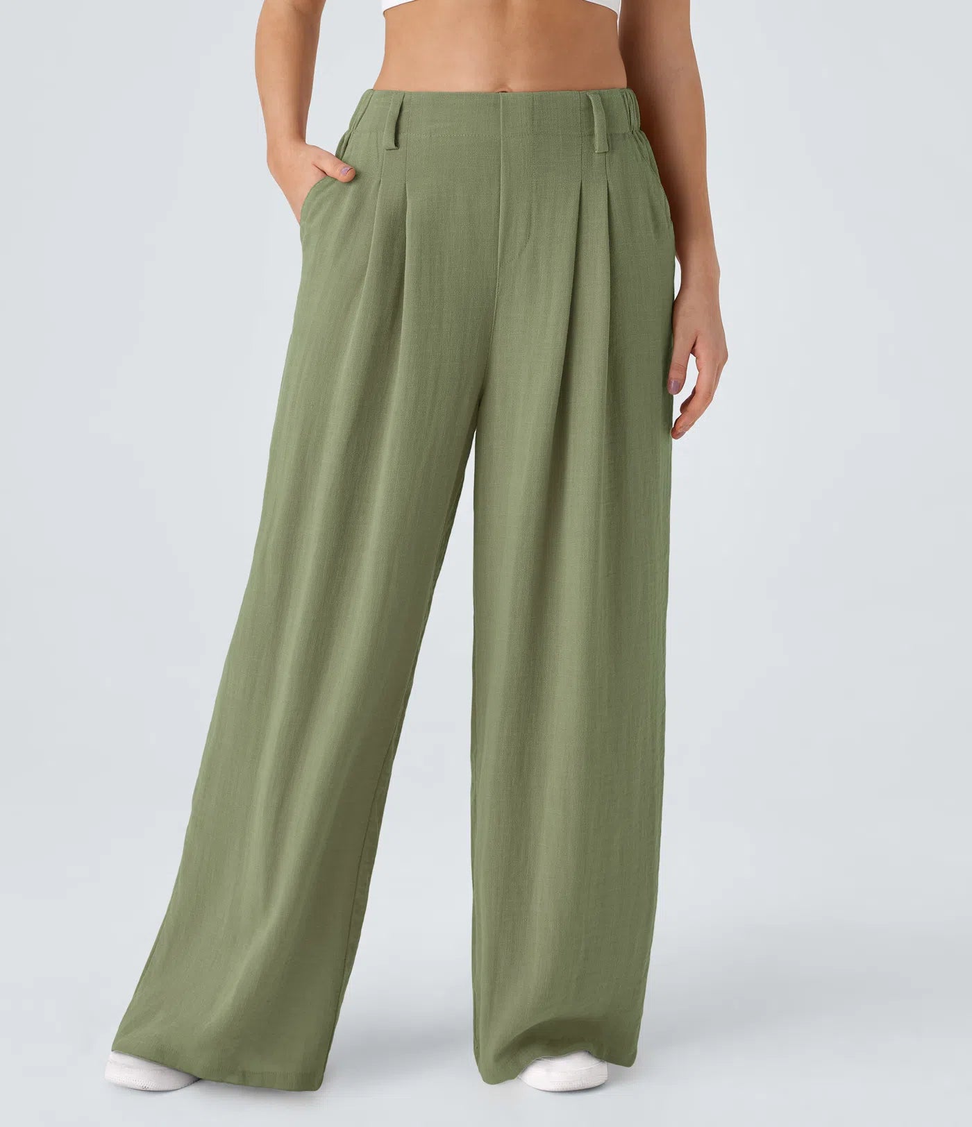 Pleated, flowing palazzo pants with a linen feel, side pockets, and wide legs.