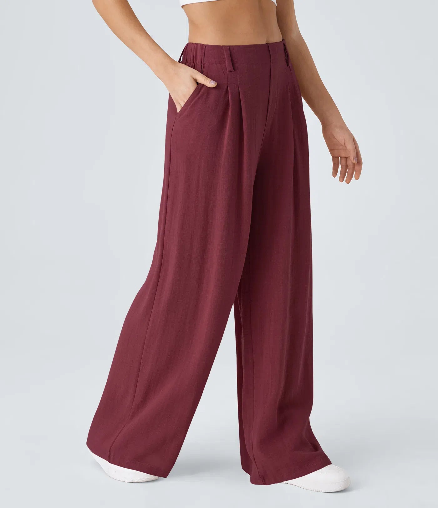 Pleated, flowing palazzo pants with a linen feel, side pockets, and wide legs.