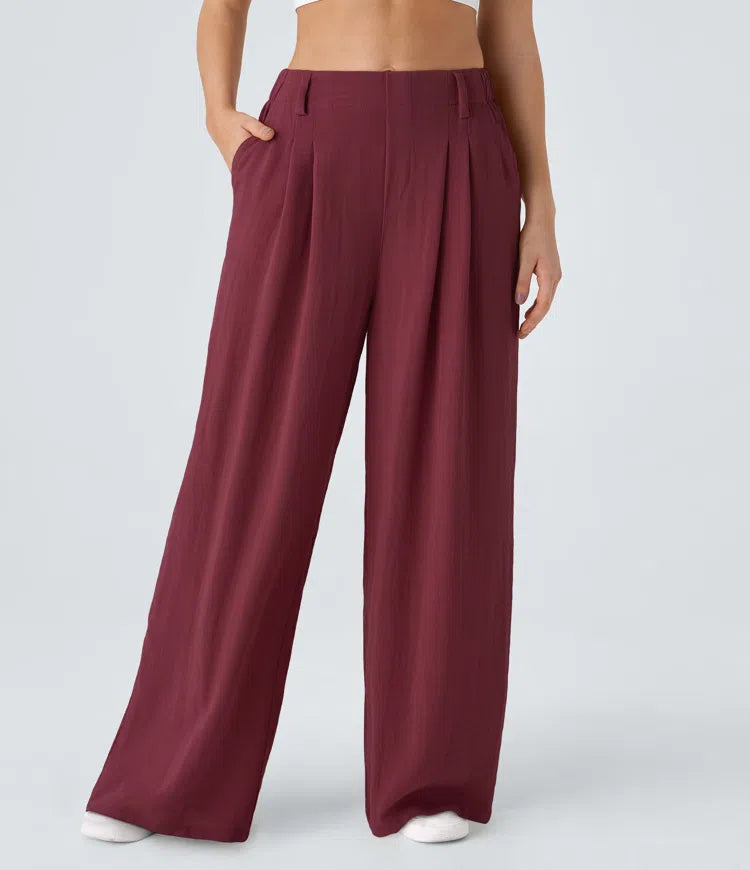 Pleated, flowing palazzo pants with a linen feel, side pockets, and wide legs.