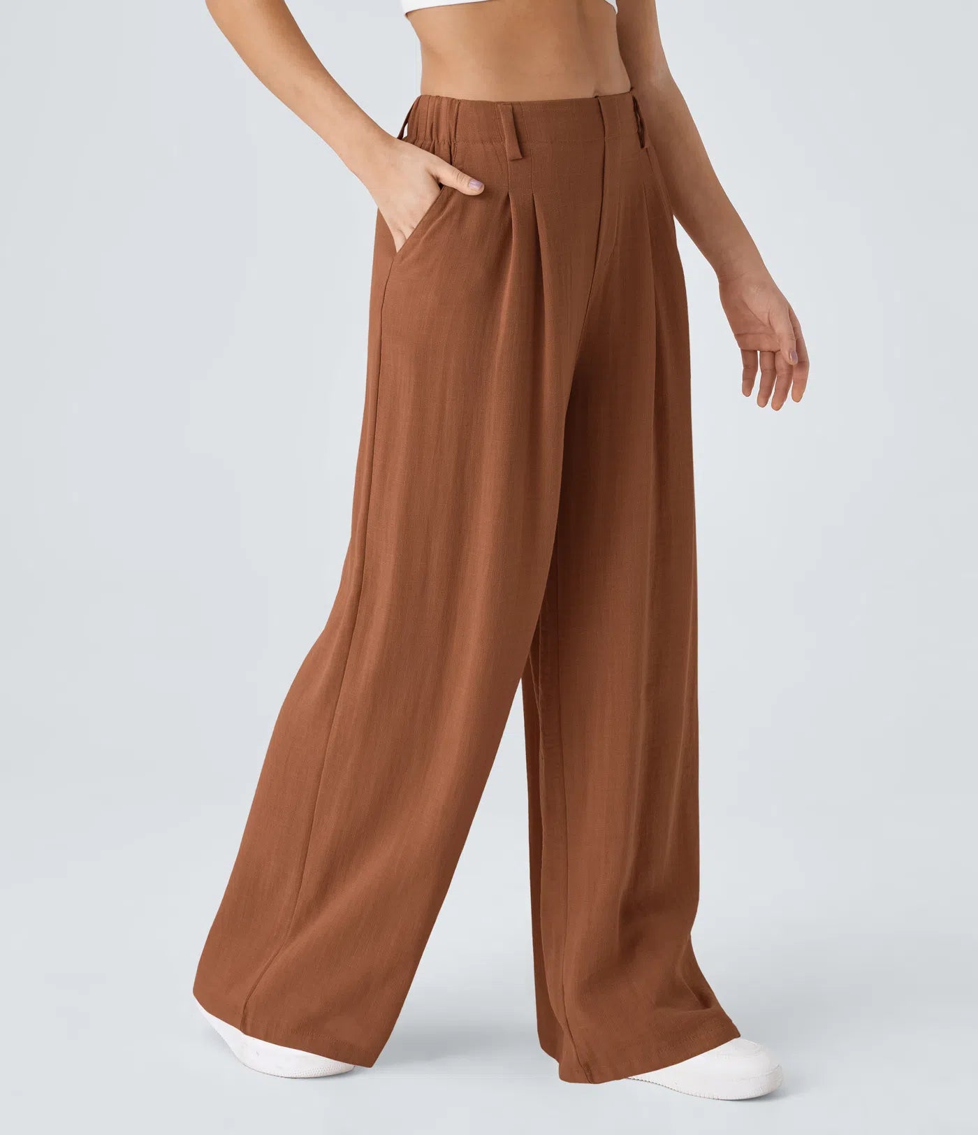 Pleated, flowing palazzo pants with a linen feel, side pockets, and wide legs.